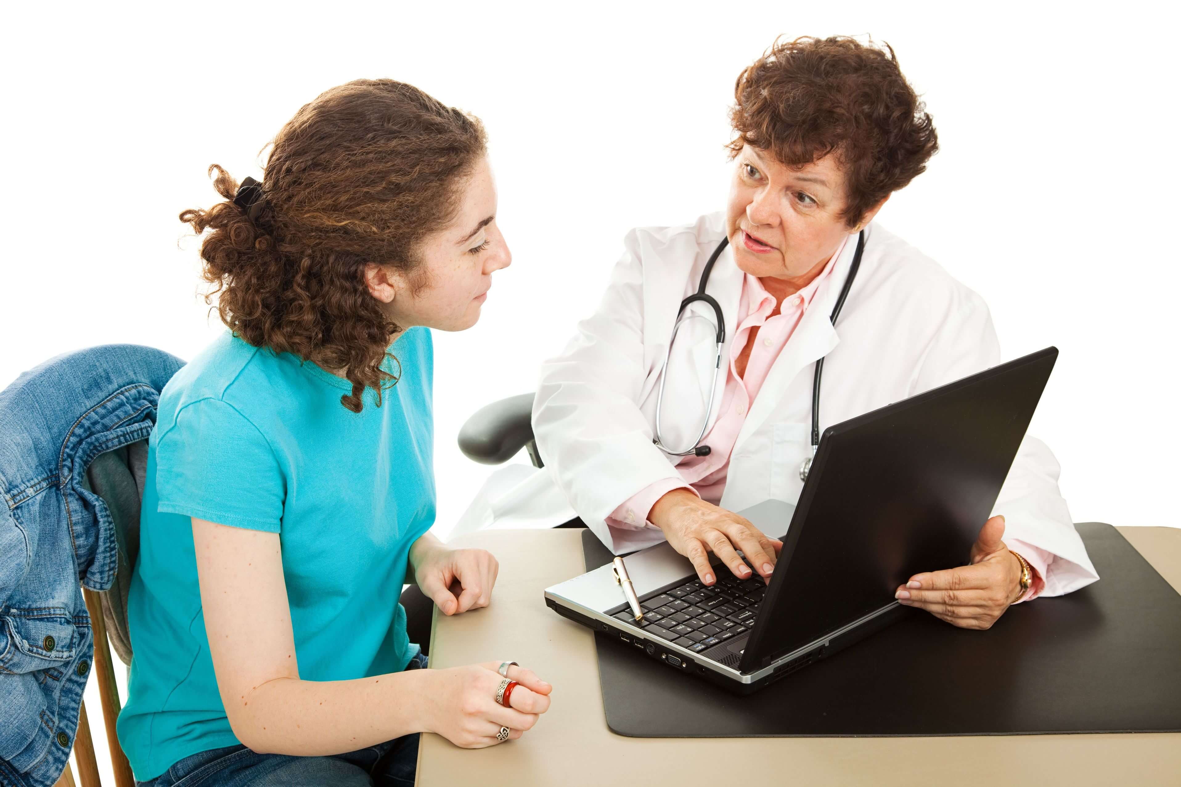 Doctor at her desk talking to a patient